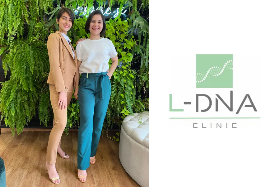 Duas mulheres vestindo os uniformes da L-DNA Clinic criados pela Dash Uniformes.